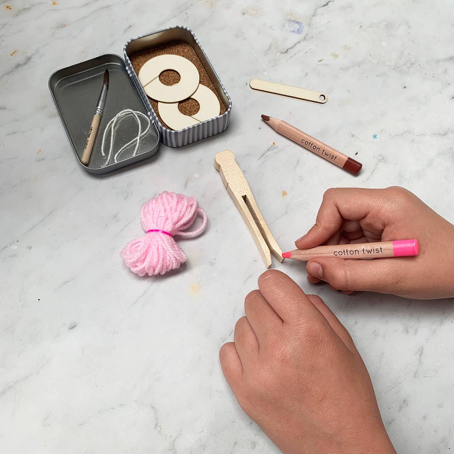 Children will love creating their own ballerina peg doll. Once the pom pom has been created with the help of the wooden needle and; pom pom maker, the peg doll dancer can be assembled &amp; decorated using the watercolour pencils