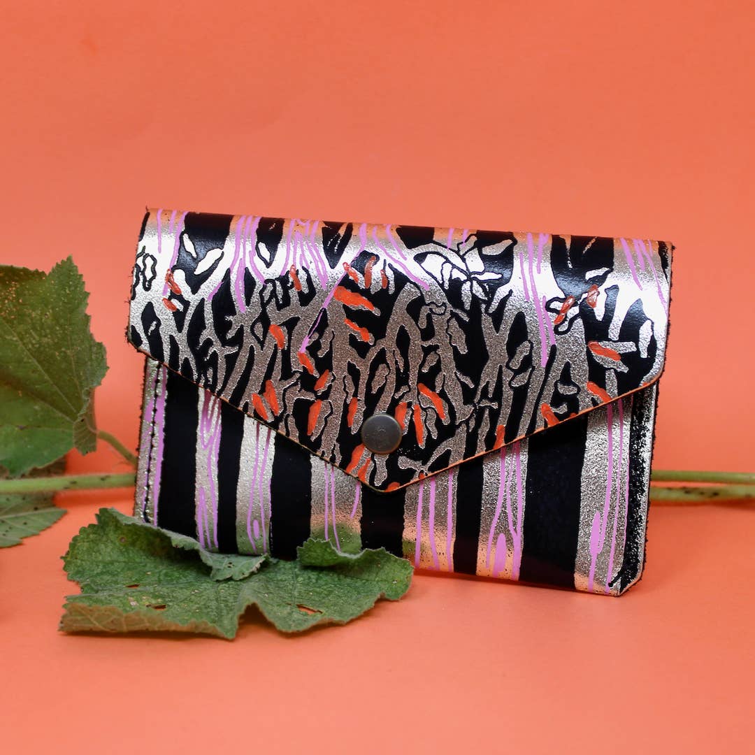 Introducing the newest addition to the Ark Colour Design collection - the Forest Popper Purse! Designed in our Cambridge studio and crafted in Scotland, they have created a striking embossed tree design which is designed to be practical and joyful. Individually hand embossed with both shiny and matte foil.