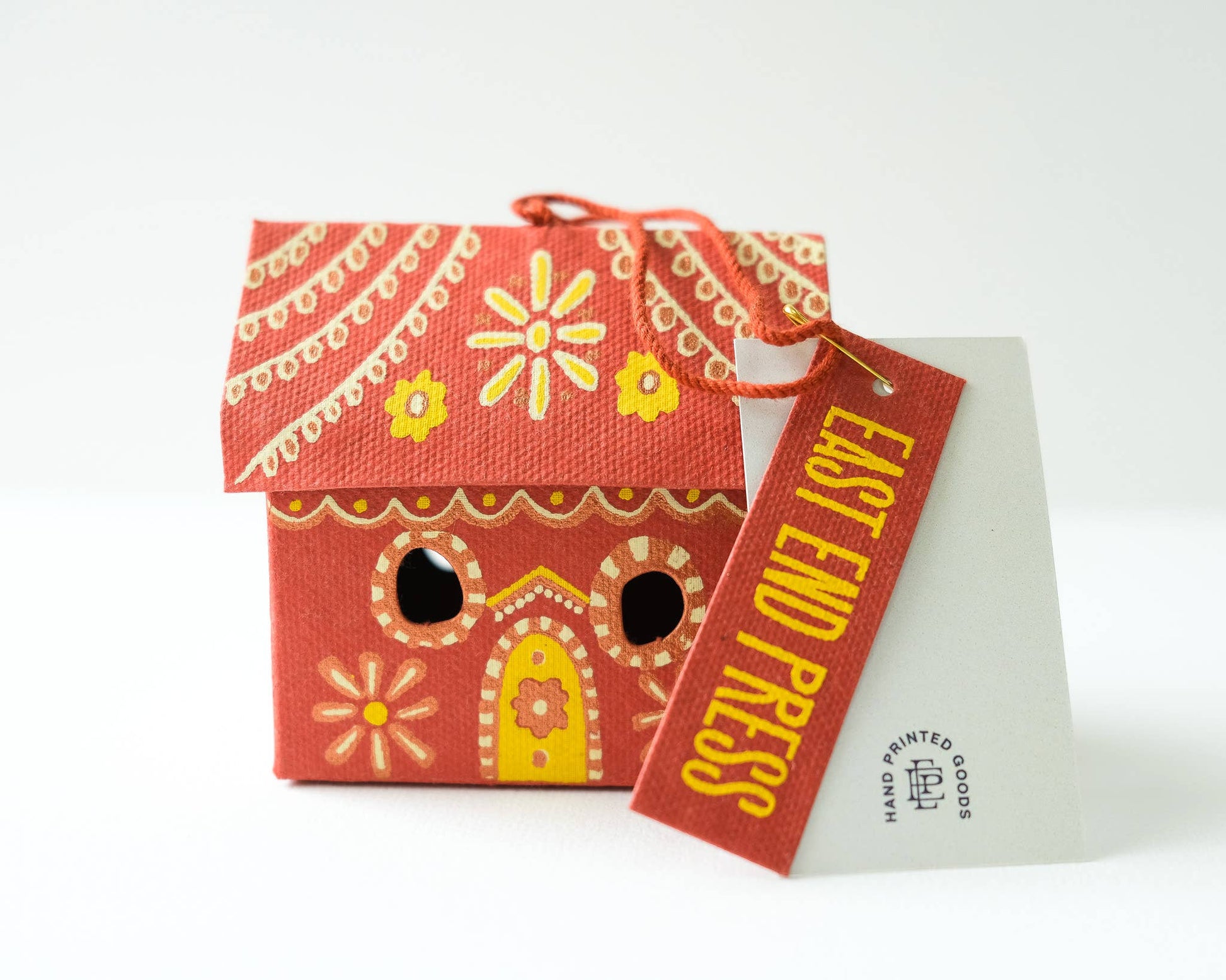 Gingerbread House Screen printed board hanging ornament, sustainably made from 100% recycled paper.