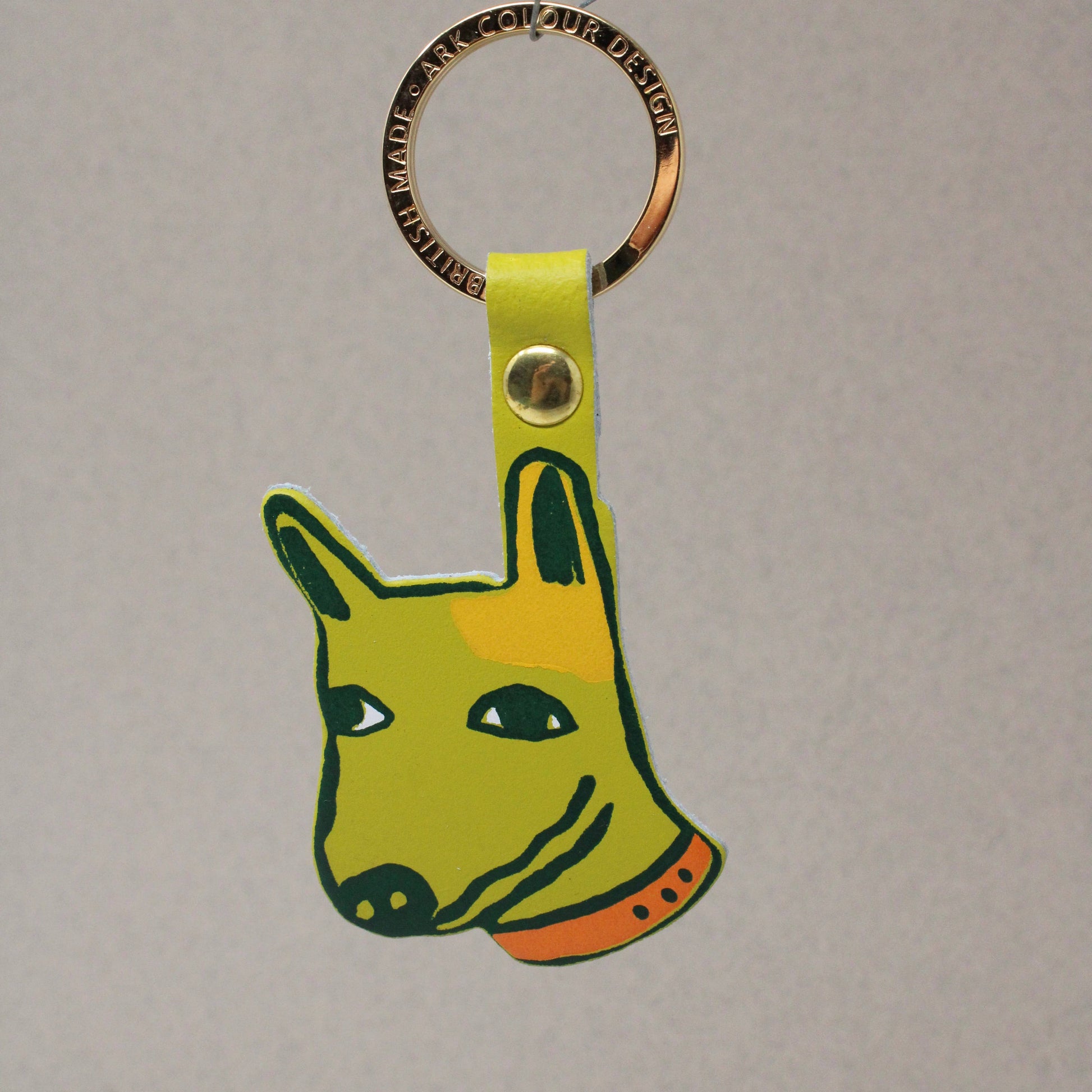 Genuine Leather Dog Keyring. Colourful orange pup with 'best mate' embossed on the reverse. A playful design with a sweet sentiment. Made using the traditional technique of hot foil embossing which ensures a handmade and unique product every time. Made in the UK