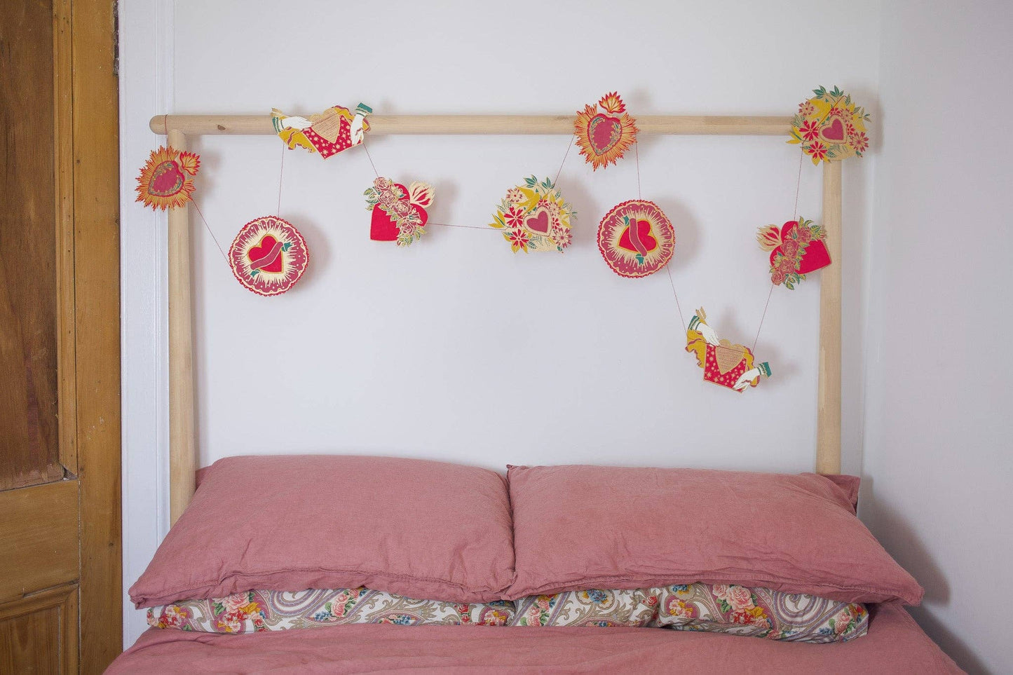 Inspired by scared hearts and Mexican folk art, this garland is full of kitsch and romance. Ten decorative, bejewelled hearts create the three metre garland.

Includes 10 paper shapes, sewn along strong cotton thread - Screen printed by hand on both sides by talented artisans in Jaipur - Sustainably made from recycled materials