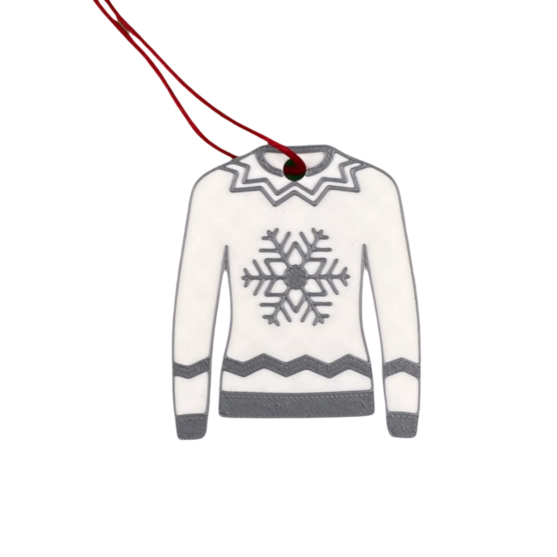 Christmas Jumper Decoration. Featuring a white jumper with a silvery grey snowflake and zig zag detailing and a red ribbon to tie on the tree.
They are sustainably 3D printed using PLA, a plant-based plastic derived from renewable resources such as sugarcane and corn starch.