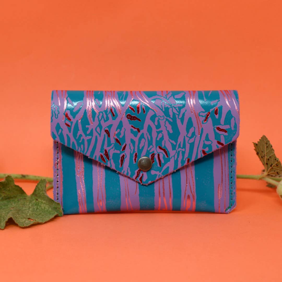 Introducing the newest addition to the Ark Colour Design collection - the Forest Popper Purse! Designed in our Cambridge studio and crafted in Scotland, they have created a striking embossed tree design which is designed to be practical and joyful. Individually hand embossed with both shiny and matte foil.