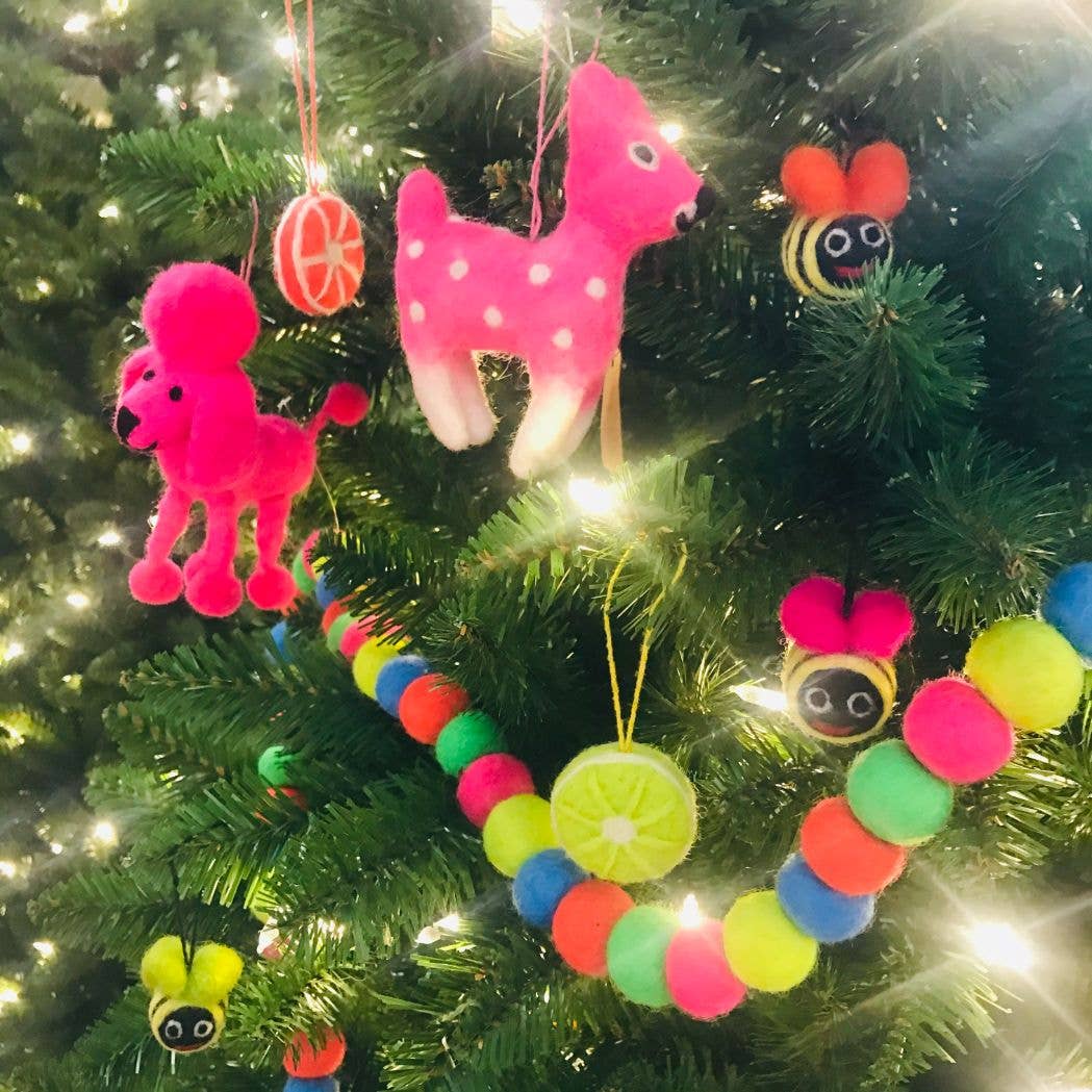 Perez the Poodle Dog Decoration. Perez the Poodle is feeling extra fly this festive season! Bright pink, a permed poof on top of his head and with legs to match, this pretentiously perfect little poodle is a perfect pressie for any pooch enthusiast