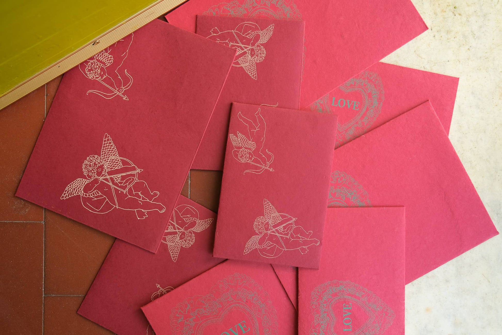 Red envelope with cherub printed.