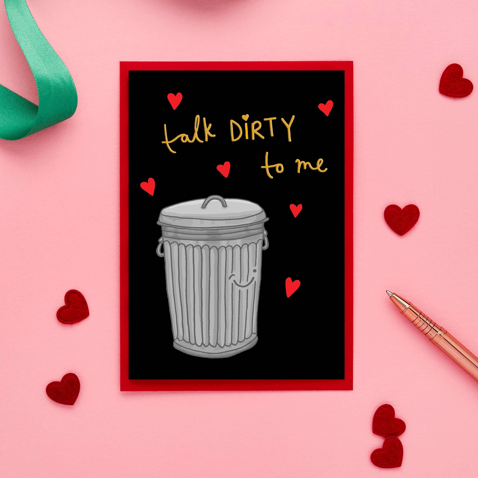 This one-of-a-kind Valentine’s card takes romance to a whole new level with its playful, hand-drawn illustration of a trash bin and the cheeky caption, "Talk Dirty to Me."