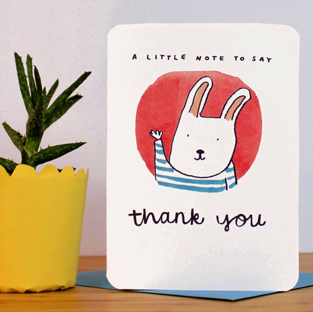 A Little Note to say Thank You Card. Featuring a bunny in a breton jumper waving against a red background.