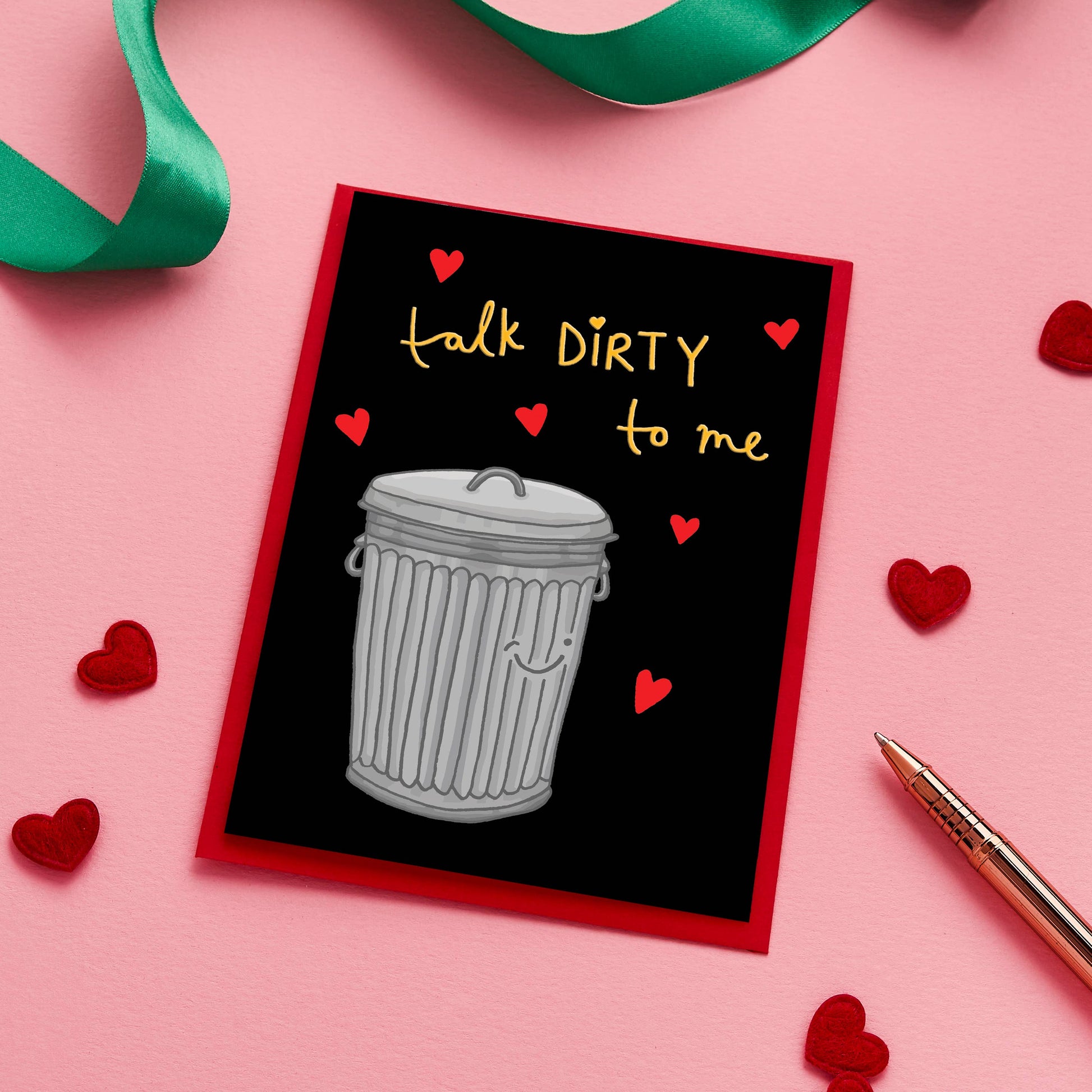 This one-of-a-kind Valentine’s card takes romance to a whole new level with its playful, hand-drawn illustration of a trash bin and the cheeky caption, "Talk Dirty to Me."