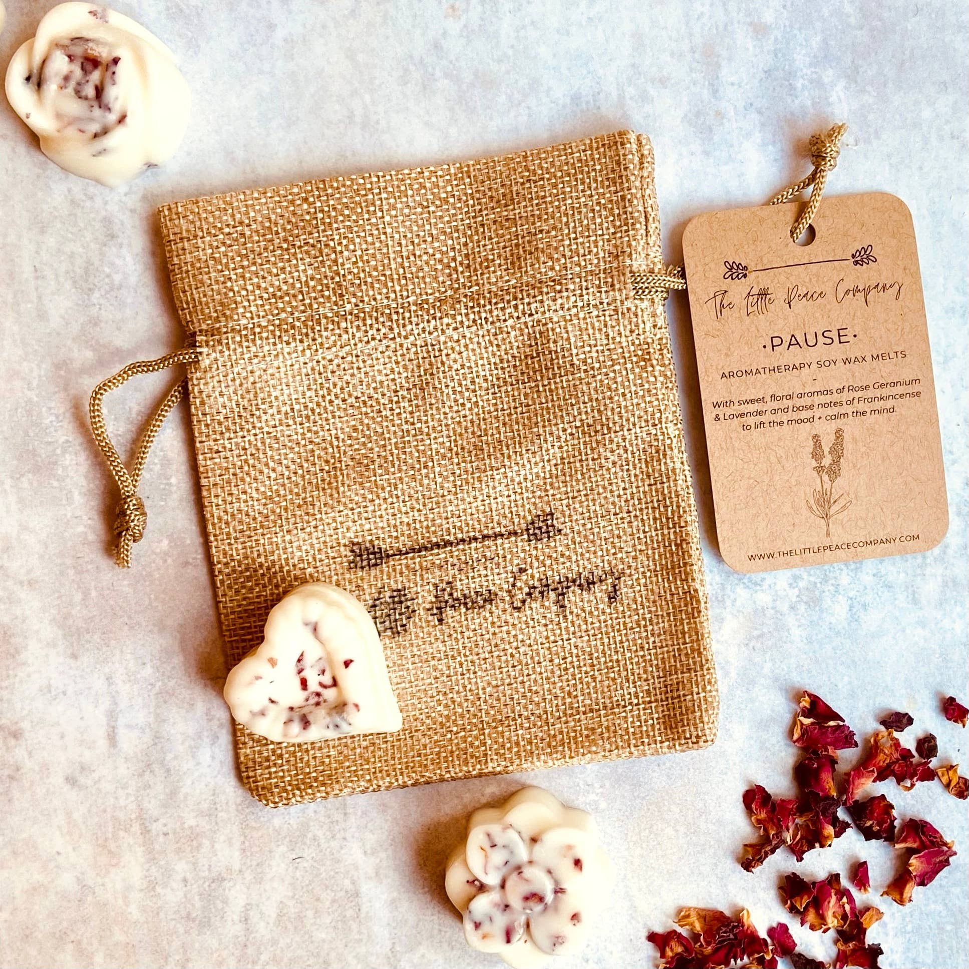 Pause Aromatherapy Soy Wax Melts with essential oils, Lavender, Frankincense + Rose Geranium. Fresh, sweet, floral aromas with base notes of Frankincense to create an uplifting and nurturing atmosphere. Five wax melts come in a burlap bag.