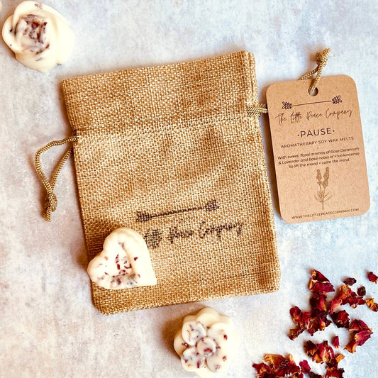 Pause Aromatherapy Soy Wax Melts with essential oils, Lavender, Frankincense + Rose Geranium. Fresh, sweet, floral aromas with base notes of Frankincense to create an uplifting and nurturing atmosphere. Five wax melts come in a burlap bag.