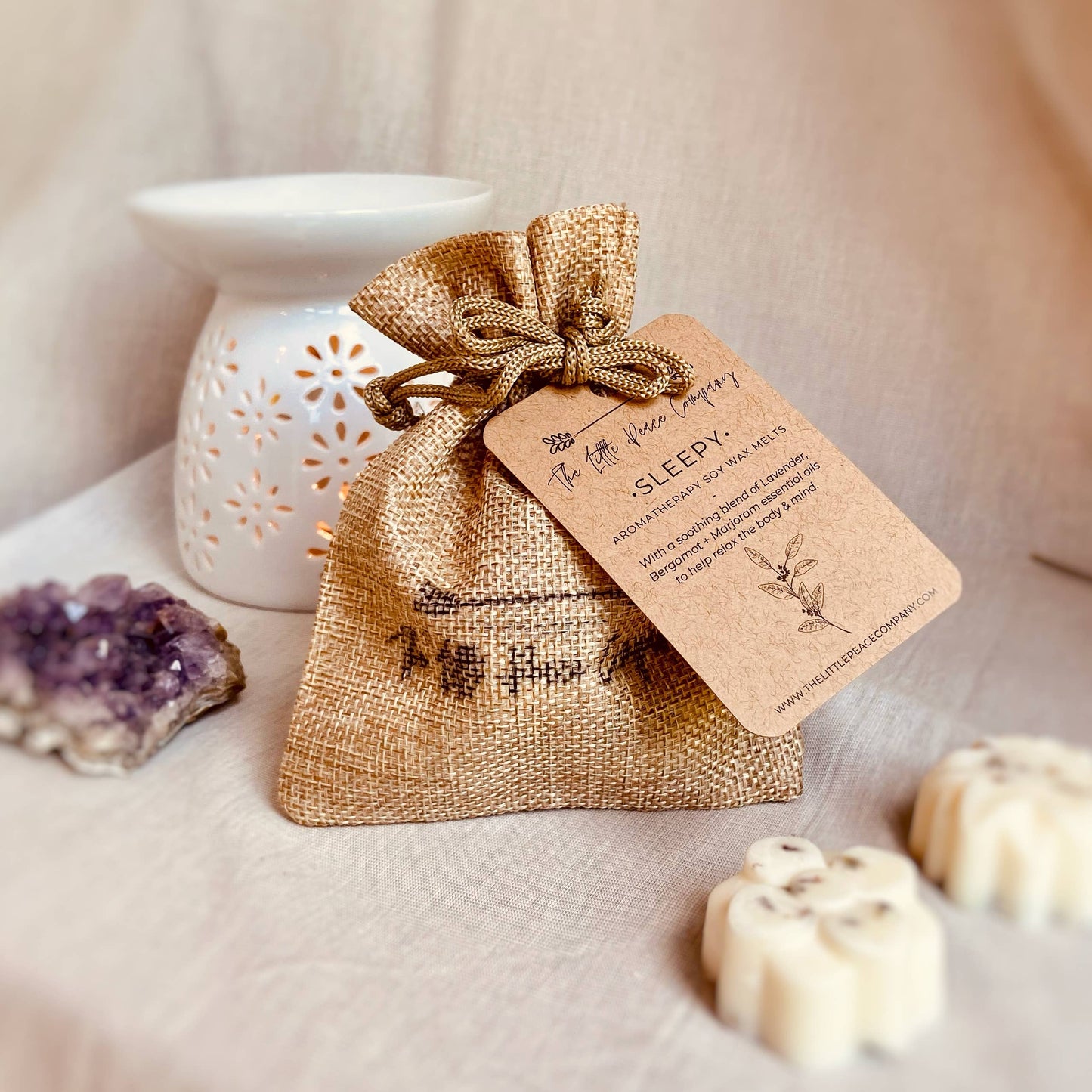 Sleepy Aromatherapy Soy Wax Melts with essential oils with soothing aromas of Lavender, Bergamot + Marjoram essential oils. Finished by hand with dried English Lavender. Five wax melts come in a burlap bag.