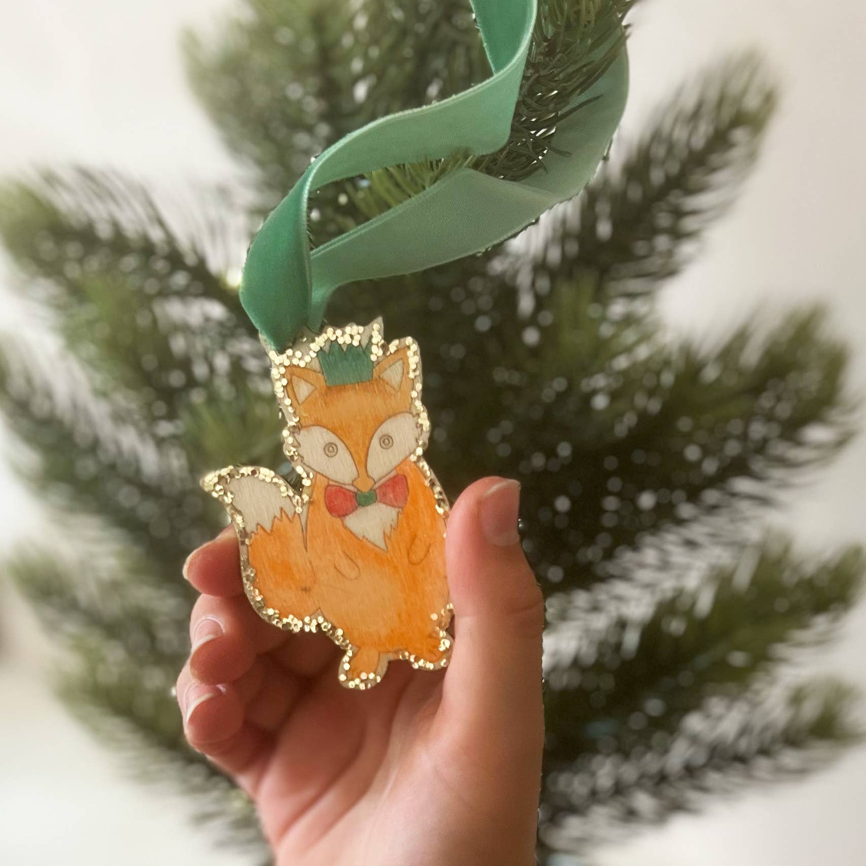 Make Your Own Christmas Fox Decoration. Children will love creating their own wooden Christmas fox decoration, using the watercolour pencils and mini paintbrush to decorate the chosen design. Use the eco glitter glue for extra sparkle and then add the velvet ribbon before hanging in place.