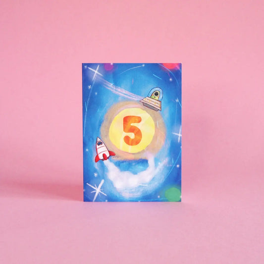 Illustrated 5th birthday card, featuring space rockets, aliens, planets and a galaxy of stars. Sustainably made in the UK