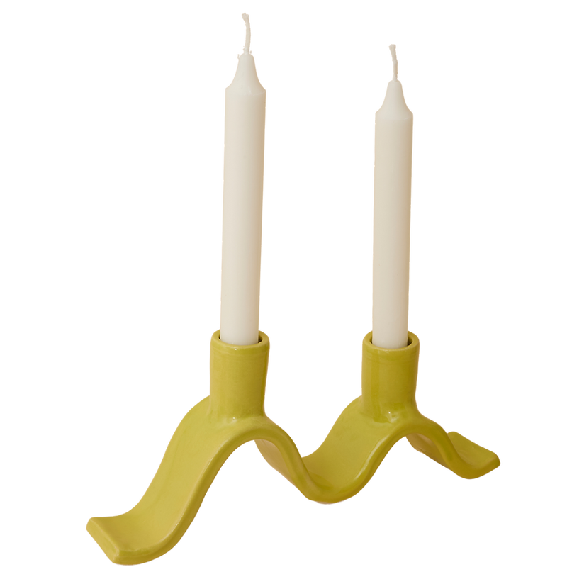 Handcrafted Small Wavy Candelabra - Chartreuse. Handcrafted from stoneware clay, this colourful candelabra makes for the perfect centrepiece. This unique ceramic candle holder is ideal as a decorative focal point for your dining table or mantlepiece. With space for 2 taper candles, it acts as both a functional candle holder and sculptural showpiece. The Wavy Candelabra will make a unique addition to your home add a touch of joy to the everyday.