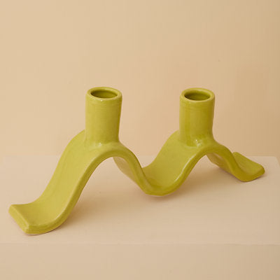 Handcrafted Small Wavy Candelabra - Chartreuse. Handcrafted from stoneware clay, this colourful candelabra makes for the perfect centrepiece. This unique ceramic candle holder is ideal as a decorative focal point for your dining table or mantlepiece. With space for 2 taper candles, it acts as both a functional candle holder and sculptural showpiece. The Wavy Candelabra will make a unique addition to your home add a touch of joy to the everyday.