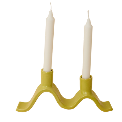 Handcrafted Small Wavy Candelabra - Chartreuse. Handcrafted from stoneware clay, this colourful candelabra makes for the perfect centrepiece. This unique ceramic candle holder is ideal as a decorative focal point for your dining table or mantlepiece. With space for 2 taper candles, it acts as both a functional candle holder and sculptural showpiece. The Wavy Candelabra will make a unique addition to your home add a touch of joy to the everyday.