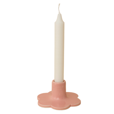 Handcrafted Solo Flower Candle Holder - Pink. Handcrafted from stoneware clay, this colourful candle holder is ideal as a decorative focal point for your dining table, mantlepiece or nightstand. The base is in the shape of a flower. 10cm wide x 4cm high