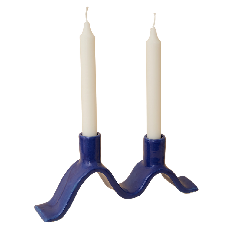 Handcrafted Small Wavy Candelabra - Blue.  Handcrafted from stoneware clay, this colourful candelabra makes for the perfect centrepiece. This unique ceramic candle holder is ideal as a decorative focal point for your dining table or mantlepiece. With space for 2 taper candles, it acts as both a functional candle holder and sculptural showpiece. The Wavy Candelabra will make a unique addition to your home add a touch of joy to the everyday.