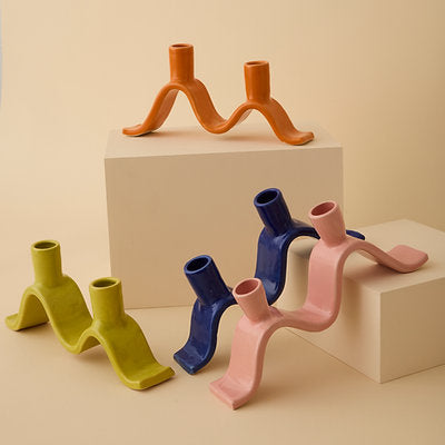 Handcrafted Small Wavy Candelabra - Chartreuse. Handcrafted from stoneware clay, this colourful candelabra makes for the perfect centrepiece. This unique ceramic candle holder is ideal as a decorative focal point for your dining table or mantlepiece. With space for 2 taper candles, it acts as both a functional candle holder and sculptural showpiece. The Wavy Candelabra will make a unique addition to your home add a touch of joy to the everyday.