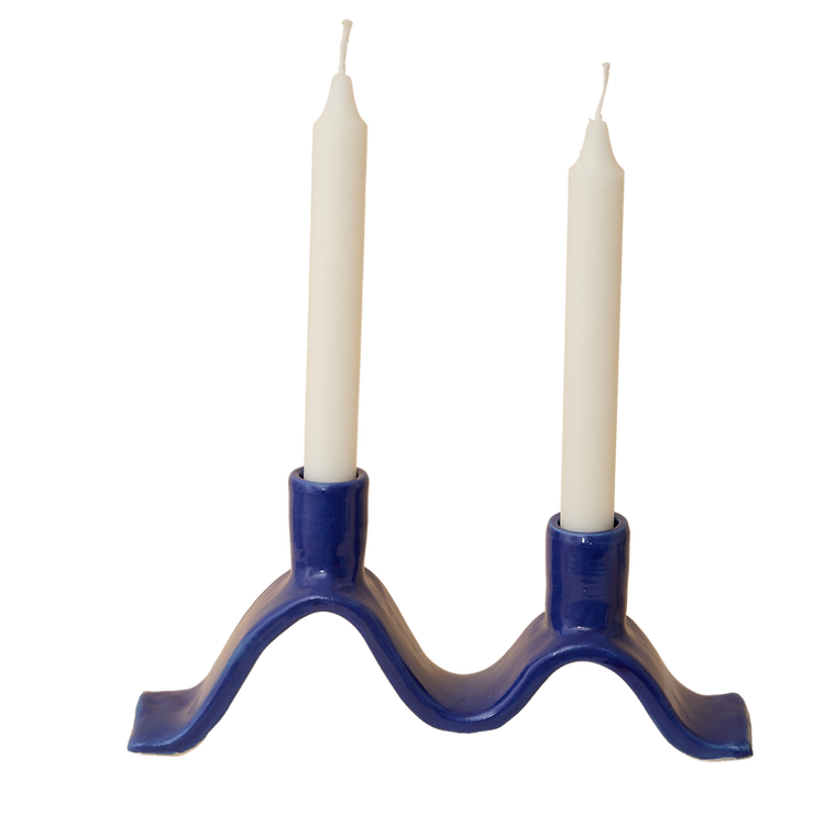 Handcrafted Small Wavy Candelabra - Blue.  Handcrafted from stoneware clay, this colourful candelabra makes for the perfect centrepiece. This unique ceramic candle holder is ideal as a decorative focal point for your dining table or mantlepiece. With space for 2 taper candles, it acts as both a functional candle holder and sculptural showpiece. The Wavy Candelabra will make a unique addition to your home add a touch of joy to the everyday.