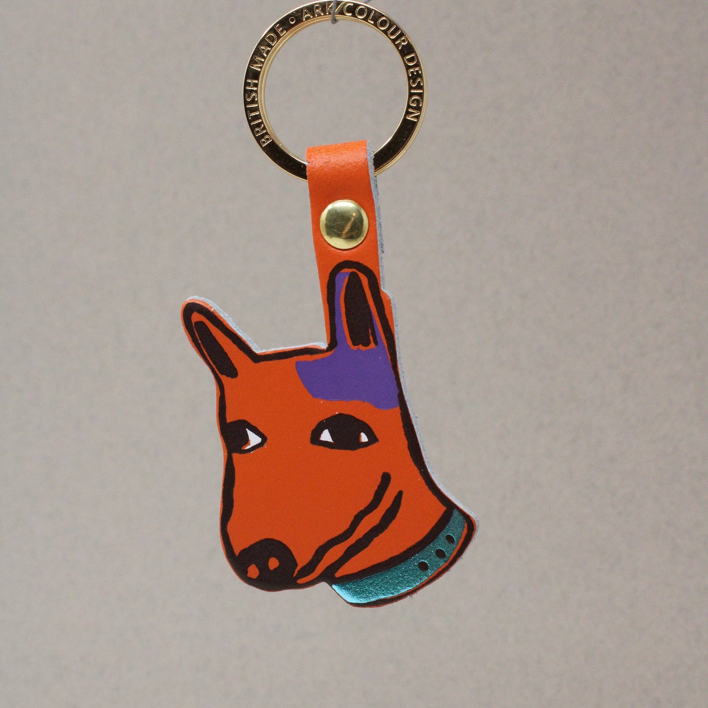 Genuine Leather Dog Keyring. Colourful orange pup with 'best mate' embossed on the reverse. A playful design with a sweet sentiment. Made using the traditional technique of hot foil embossing which ensures a handmade and unique product every time. Made in the UK