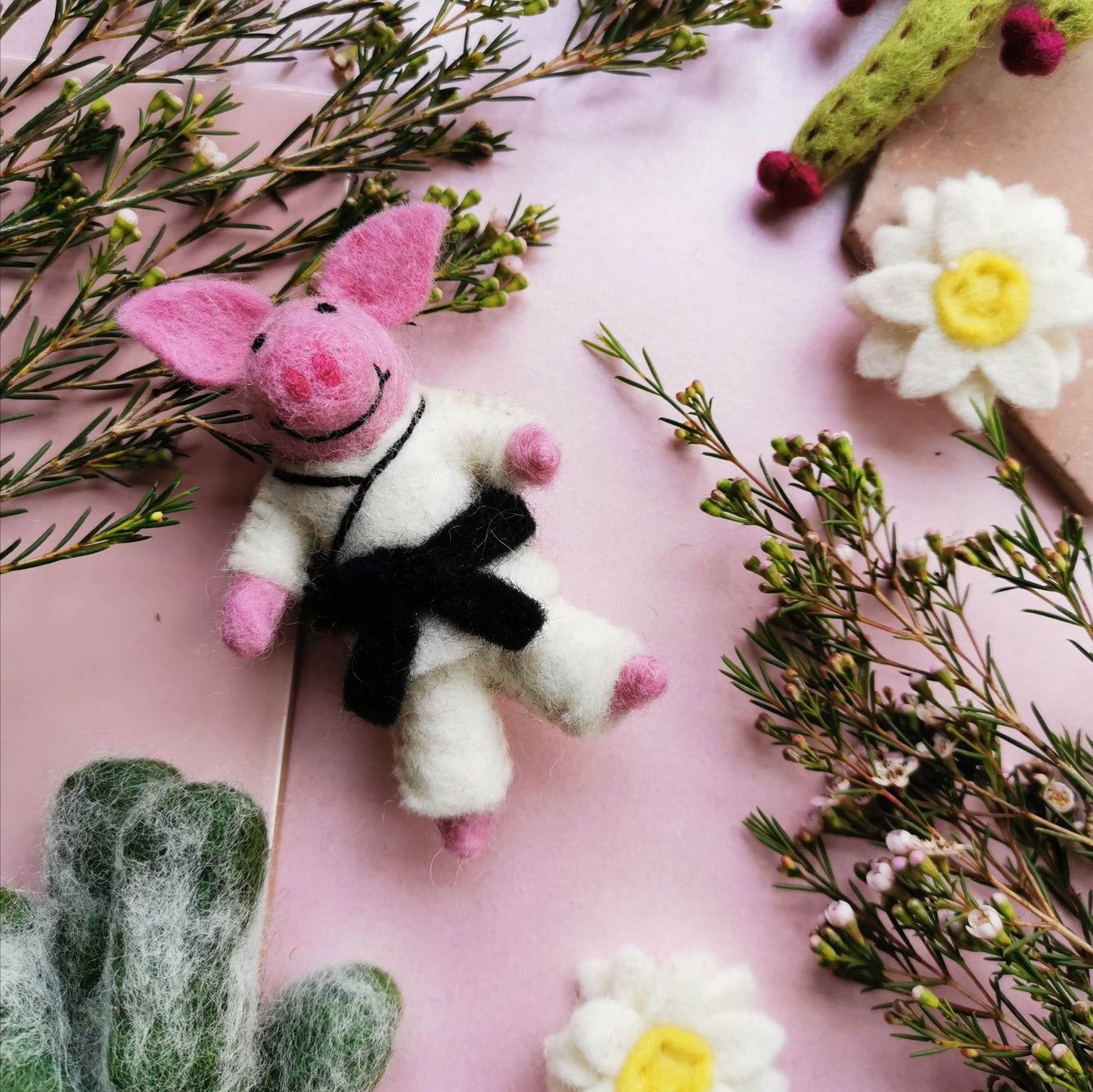 Felt pink pig in a Karate costume , hanging decoration.