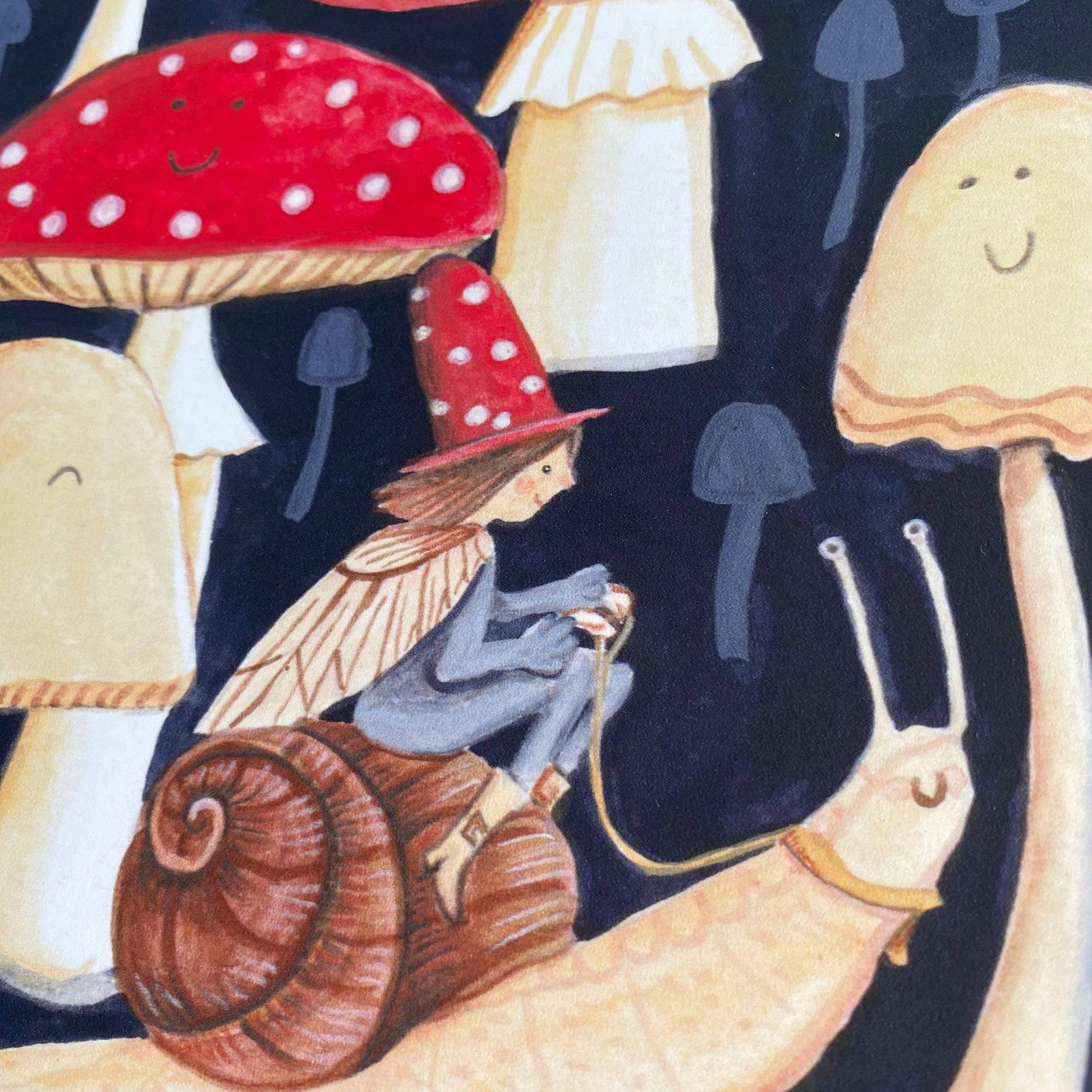 Elf riding a snail in a toadstool forest greetings card