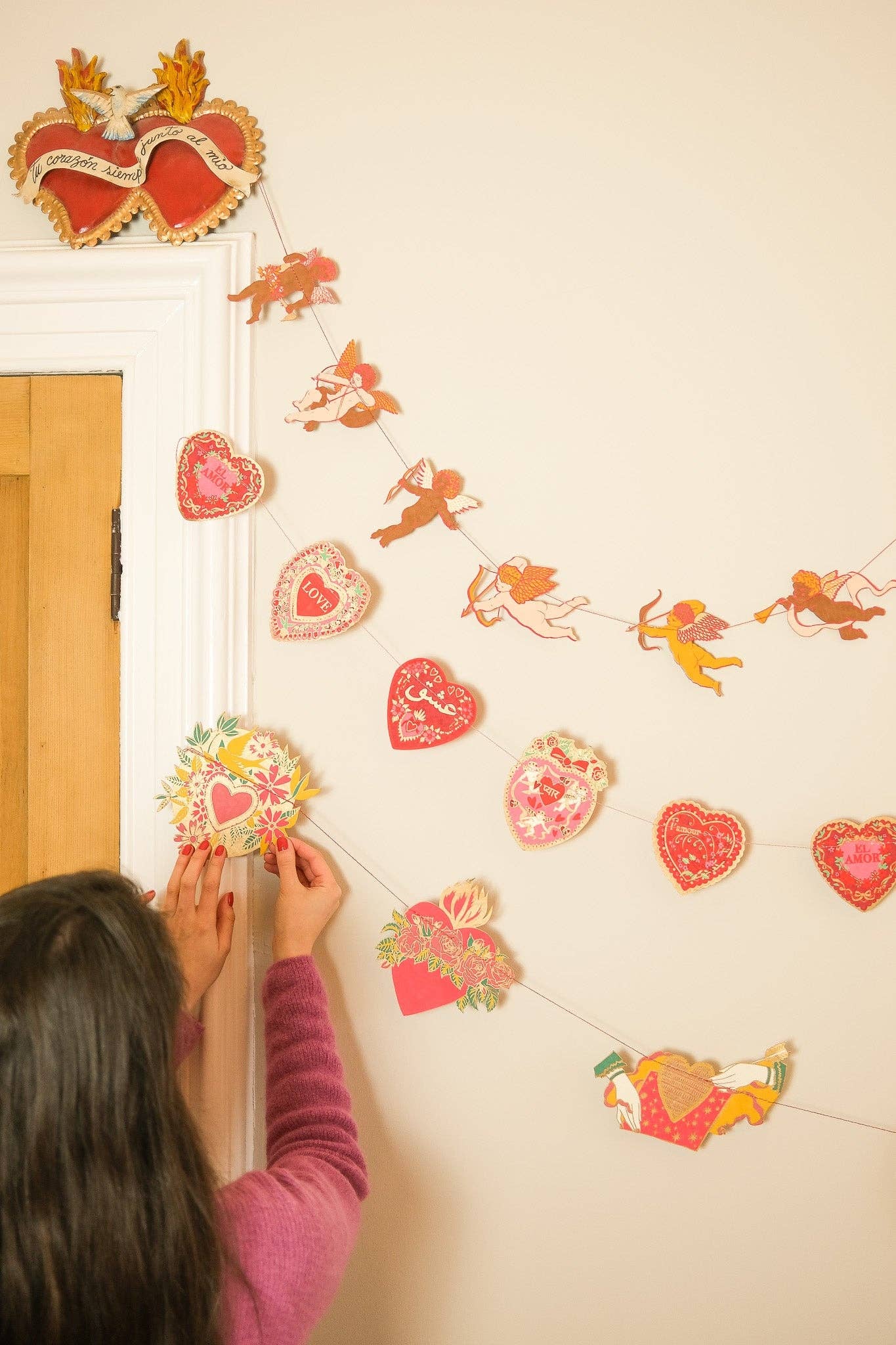 Inspired by scared hearts and Mexican folk art, this garland is full of kitsch and romance. Ten decorative, bejewelled hearts create the three metre garland.

Includes 10 paper shapes, sewn along strong cotton thread - Screen printed by hand on both sides by talented artisans in Jaipur - Sustainably made from recycled materials