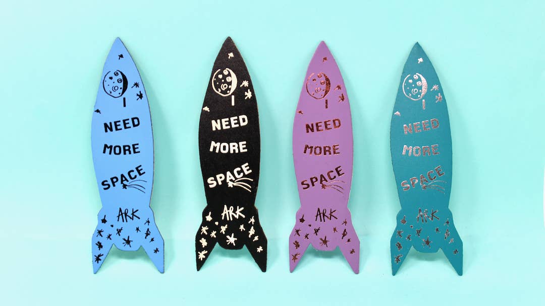 The Rocket Bookmark has landed. Embossed with 'I need more space' on the reverse. These bookmarks are designed with fun and functionality in mind, making them a great gift for the Christmas period. Each piece is carefully crafted to create a striking and multifaceted look that is sure to make a statement. We have combined both shiny and matte foil to each design, creating depth and high impact to elevate your reading experience.