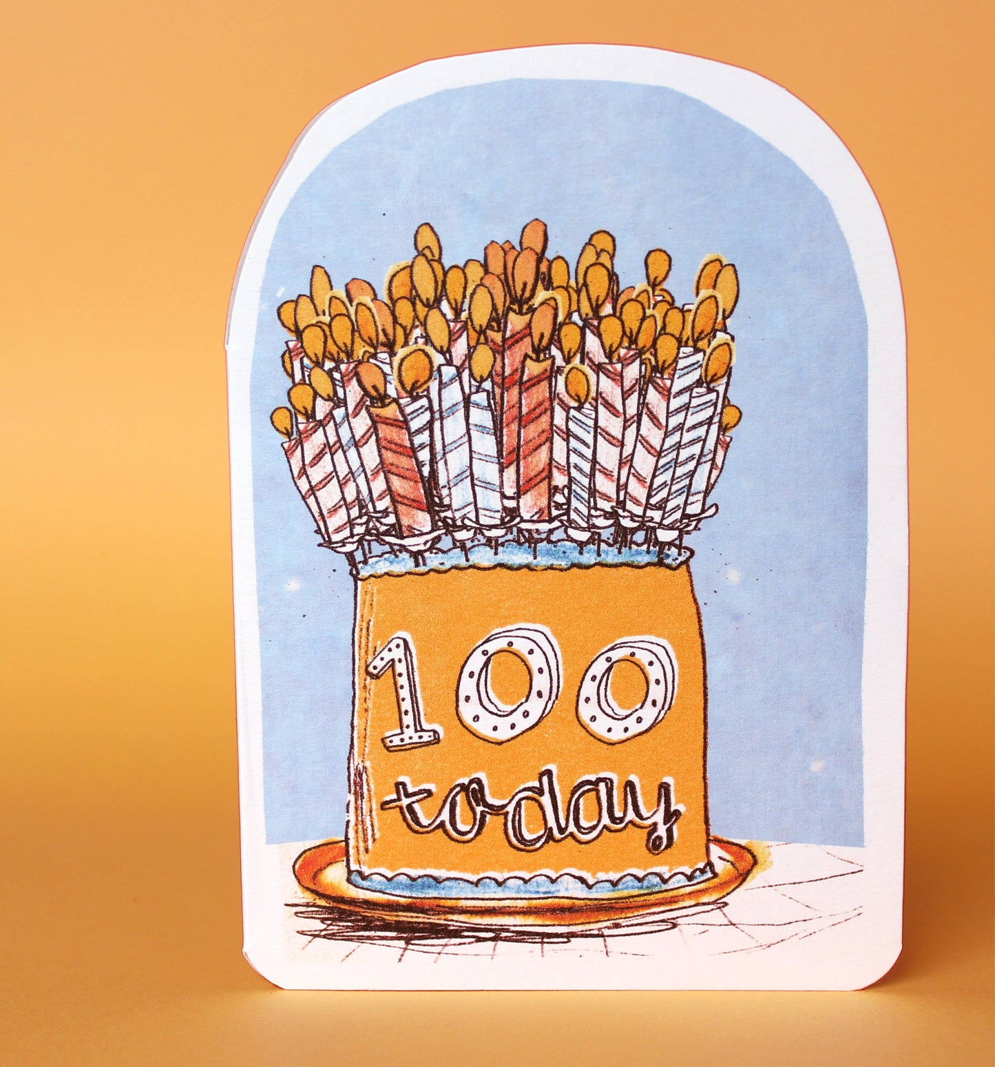 Celebrate hundred years young by blowing out the candles on this orange birthday cake, making a wish and enjoying this whimsical design by Laura Skillbeck!