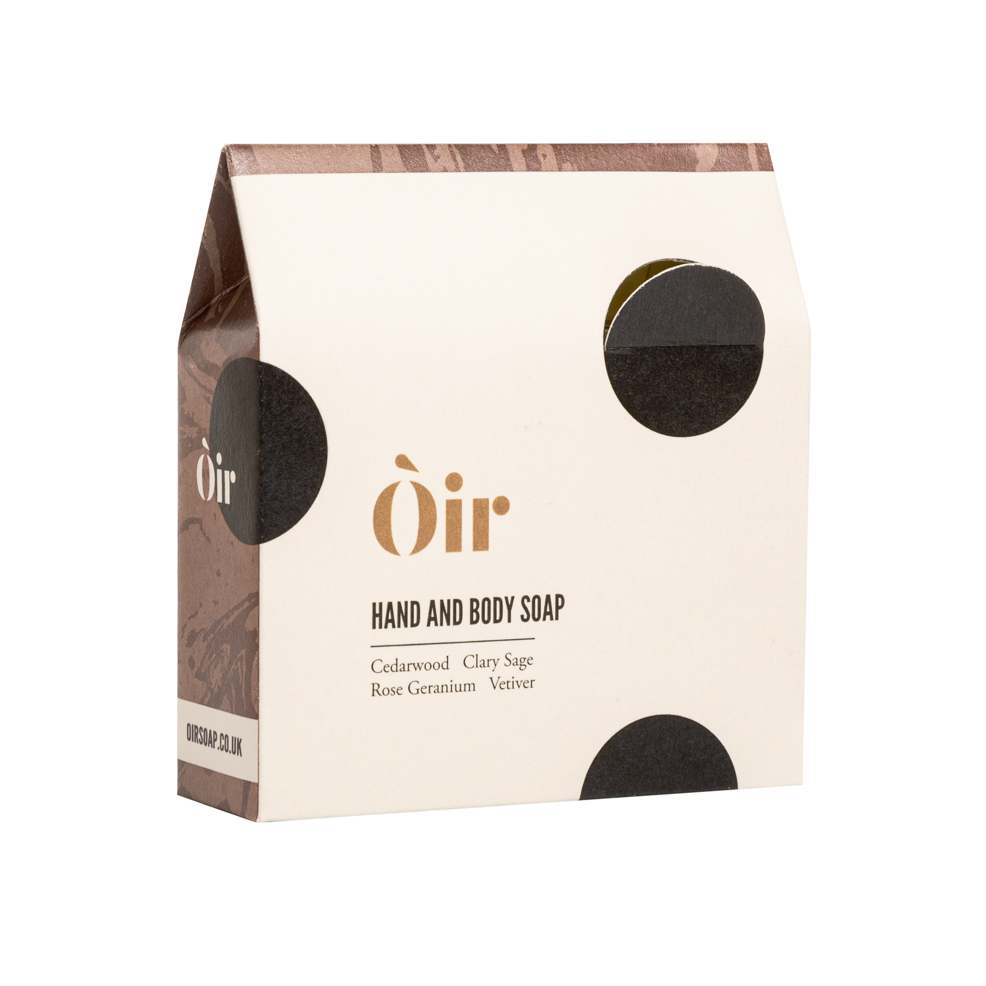 Cedarwood, Clary Sage, Rose Geranium and Vetiver Soap. Handmade in the UK. A sustainable replacement for shower gel. The soap is a cream bar with beautiful, gold lettering with the word OIR| and black swirls in the soap.