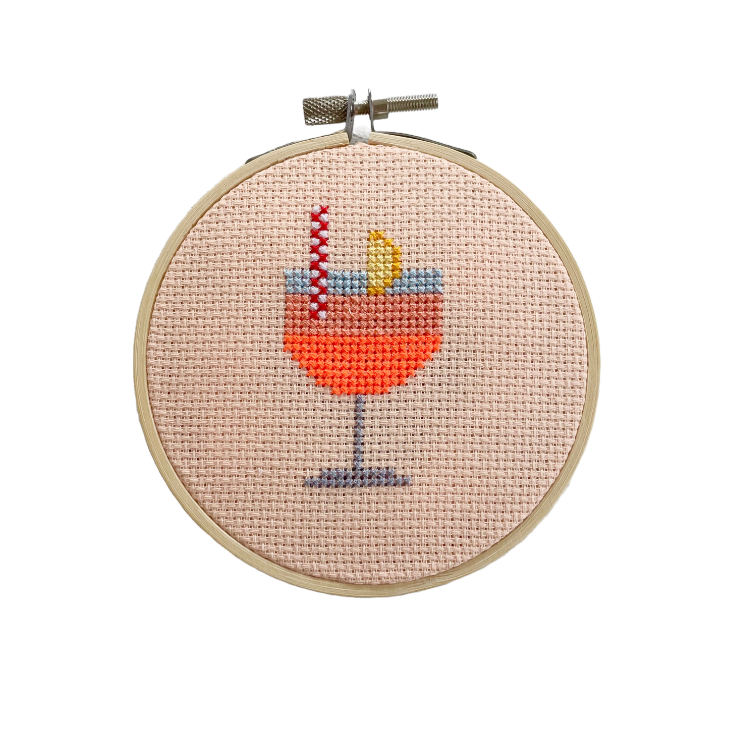 This Aperol Cocktail kit is part of our Mini Cross Stitch Collection .
The hoop measures 11cm across. Everything required to complete this kit is included: hoop, fabric, thread, needle, backing disc, wadding, instructions and full colour cross stitch chart.