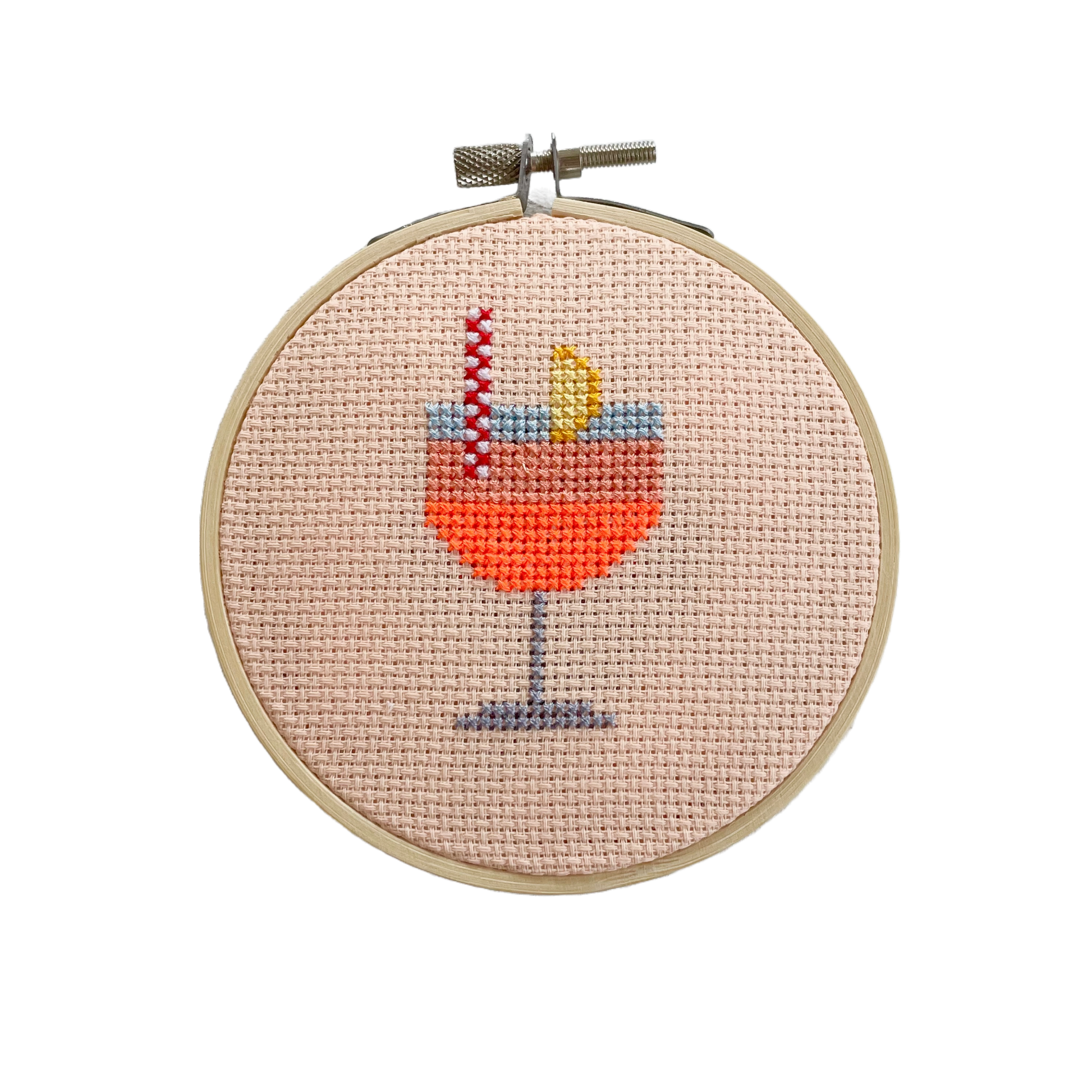 This Aperol Cocktail kit is part of our Mini Cross Stitch Collection .
The hoop measures 11cm across. Everything required to complete this kit is included: hoop, fabric, thread, needle, backing disc, wadding, instructions and full colour cross stitch chart.