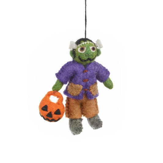  Frankenstein decoration. With his stitched-up smile and gentle expression, he's more interested in spreading joy than causing scares. Dressed in a dapper purple shirt with felted brown trousers and his pumpkin trick-or-treating basket in hand.