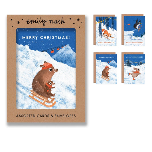 Illustrated Christmas greeting cards by Emily Nash Illustration. Snowy scenes of animals enjoying sledging, ice skating and skiing. With the words Merry Christmas!