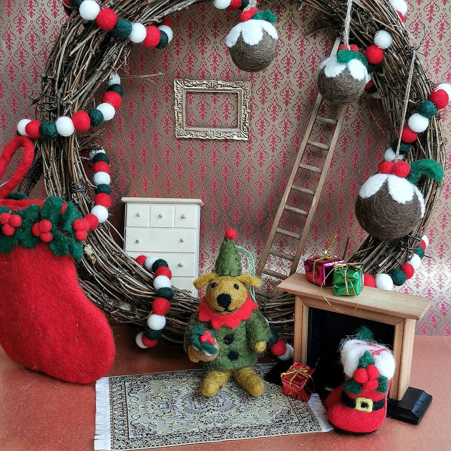 Set of three Handmade Felt Christmas Pudding Baubles Hanging. Shown with other Felt So Good Christmas Decorations.