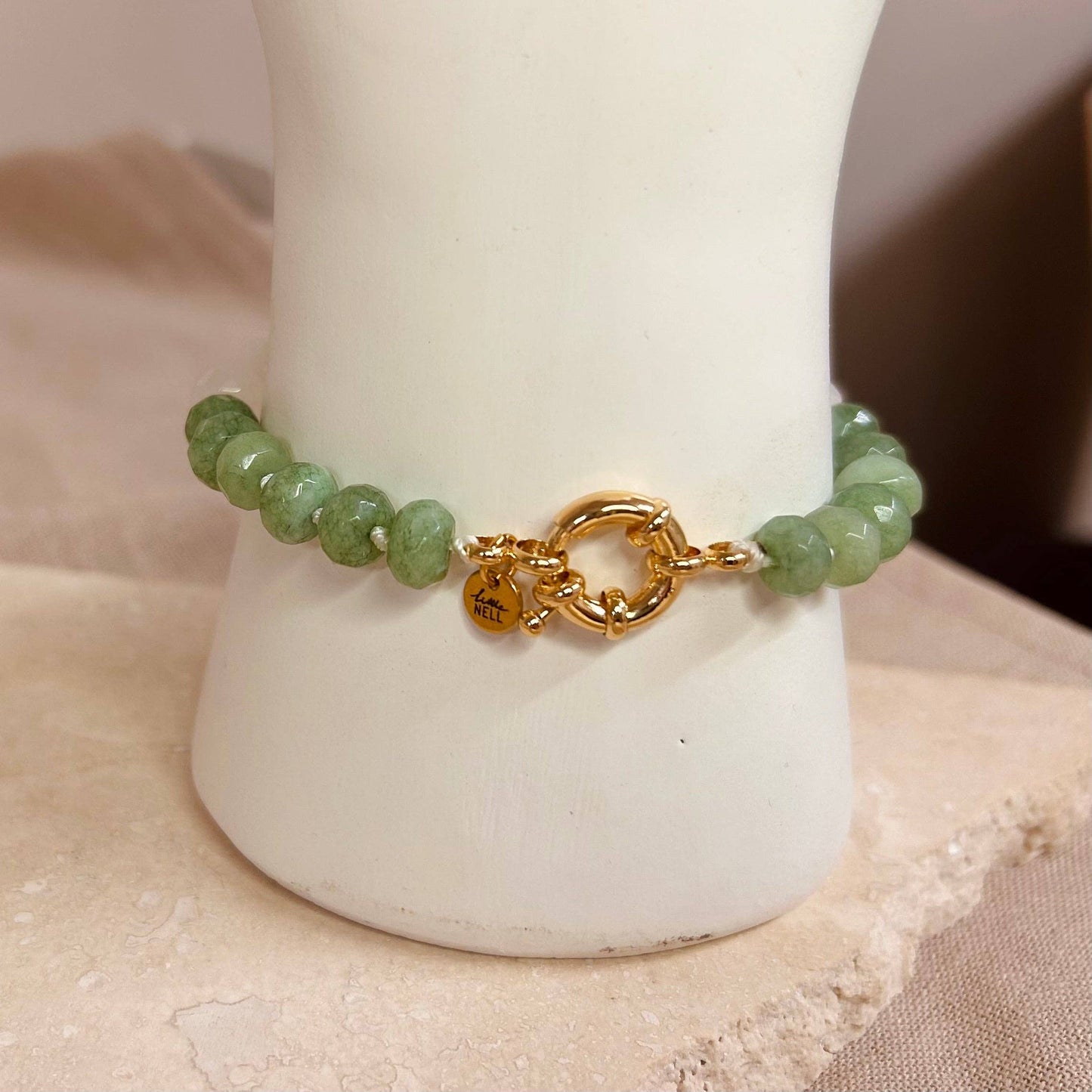 A green glass beaded bracelet, a simple, elegant design when worn alone, or can be stacked for a bolder statement look.

18k gold plated bracelet.