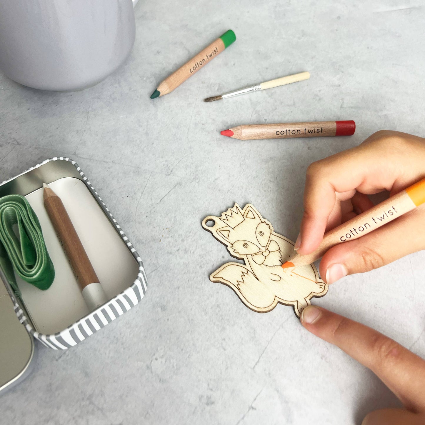 Make Your Own Christmas Fox Decoration. Children will love creating their own wooden Christmas fox decoration, using the watercolour pencils and mini paintbrush to decorate the chosen design. Use the eco glitter glue for extra sparkle and then add the velvet ribbon before hanging in place.