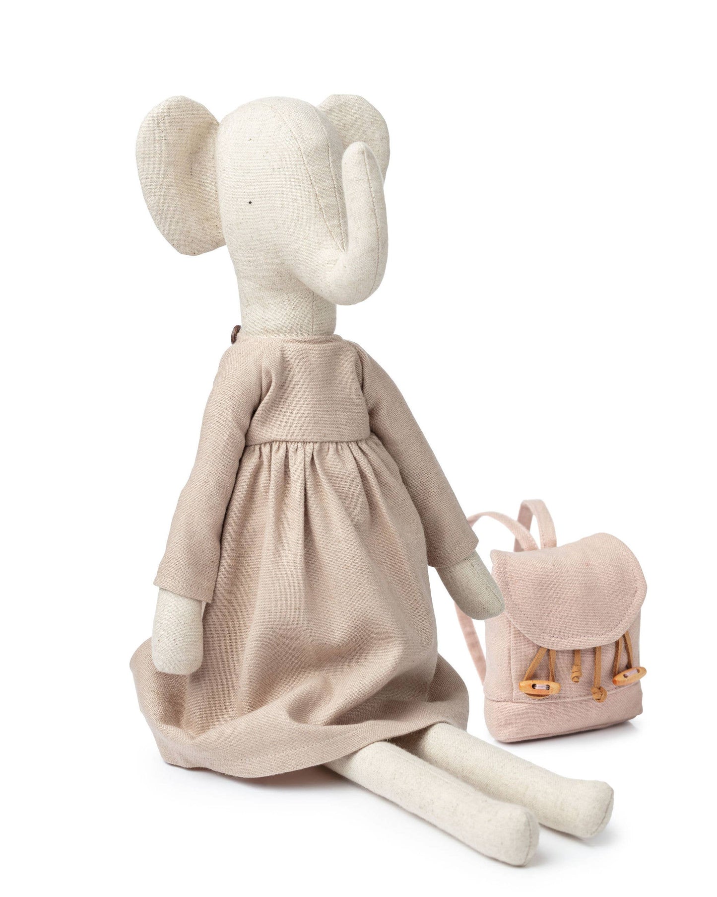 Elsie the Elephant is an adorable soft toy. Ideal for imaginative play at home or as a delightful companion on exciting outings, Elsie is perfectly sized for bedtime snuggles and fits neatly into any bag for travel fun.

Each Adventure Pickle, including Elsie, comes with its own adventure backpack, perfect for gathering treasures and creating wonderful childhood memories.
Dressed in simple, natural, earthy-toned dress..