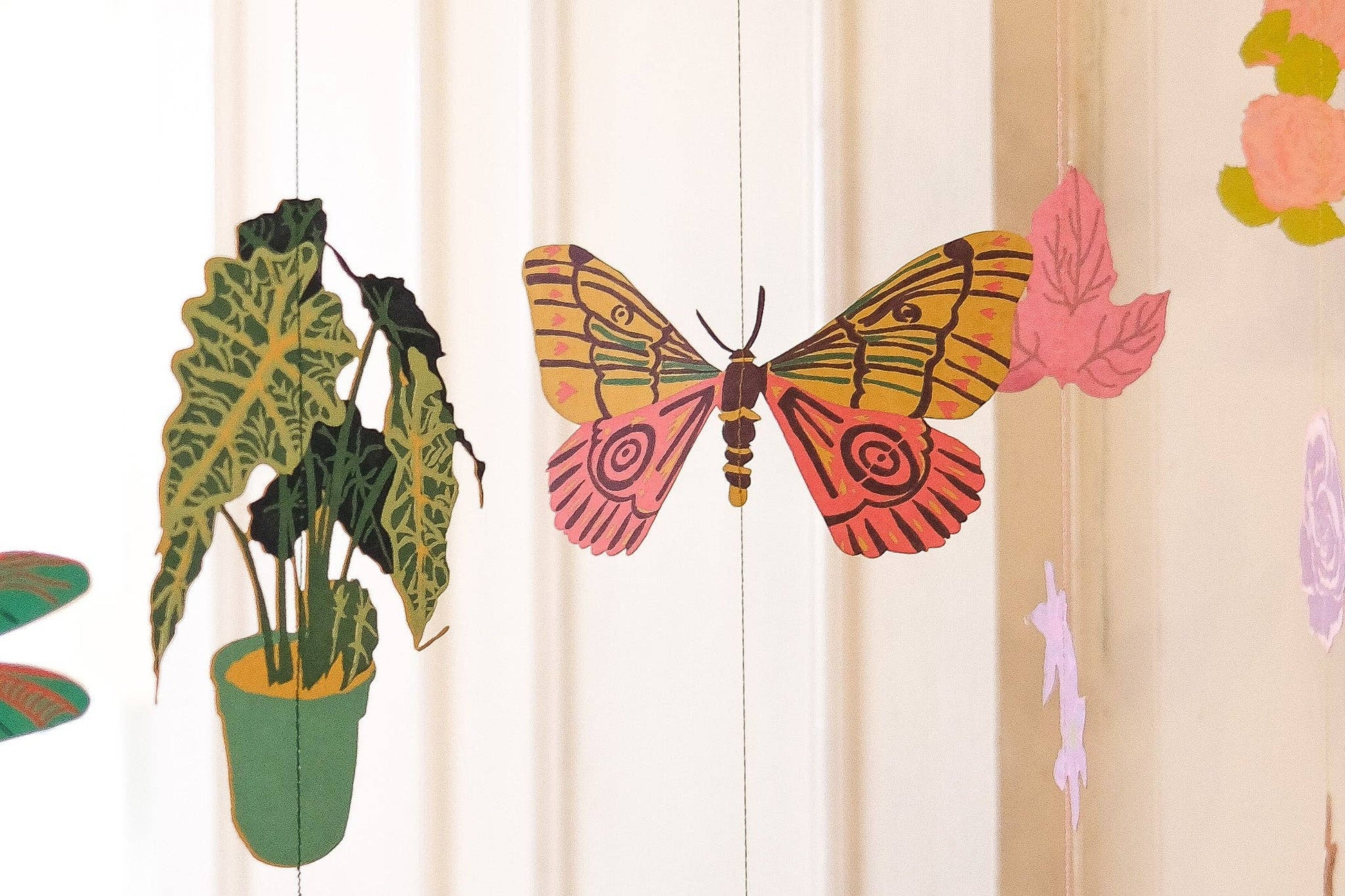 East End Press Delicate butterflies with fluttering wings bring colour and joy to your home in this two-metre-long wall hanging.

2 metres long Butterfly paper shapes are sewn along a strong cotton thread Screen printed by hand on both sides by talented artisans in Jaipur Sustainably made from recycled materials