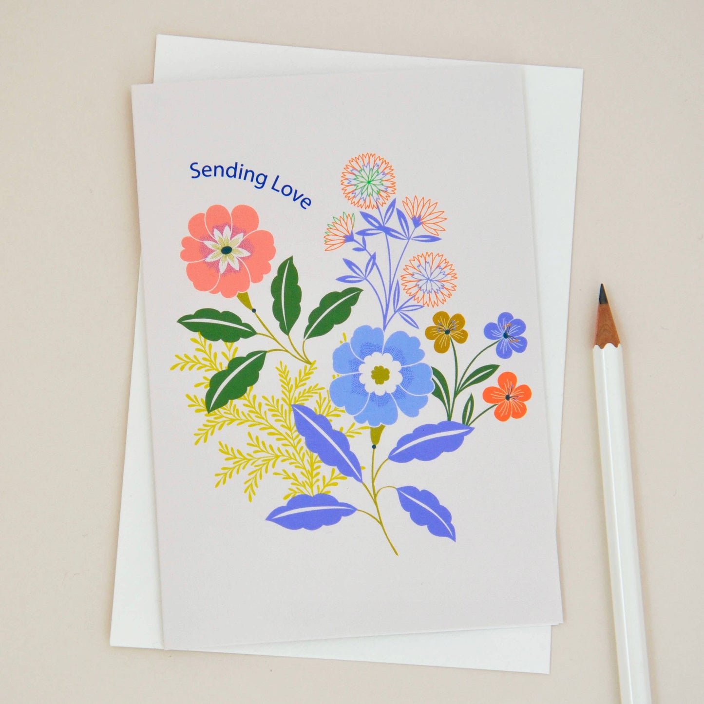 Sending Love Floral Sympathy Greetings Card. Featuring the words Sending Love, and colourful illustrated flowers against a white background.