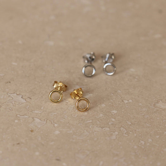 A pair of gold or silver circle studs. 3mm wide