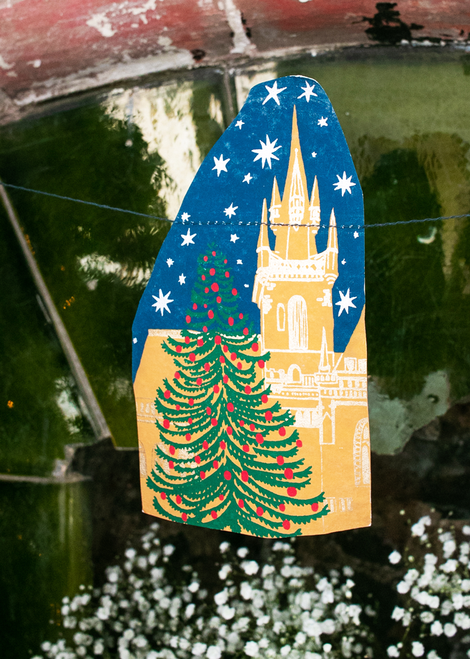 With traditional church steeples, snow tipped fir trees and Santa's sleigh, this garland features ten charming Christmas images of a festive night time skyline.

3 metres long

Includes 10 paper shapes, sewn along strong cotton thread