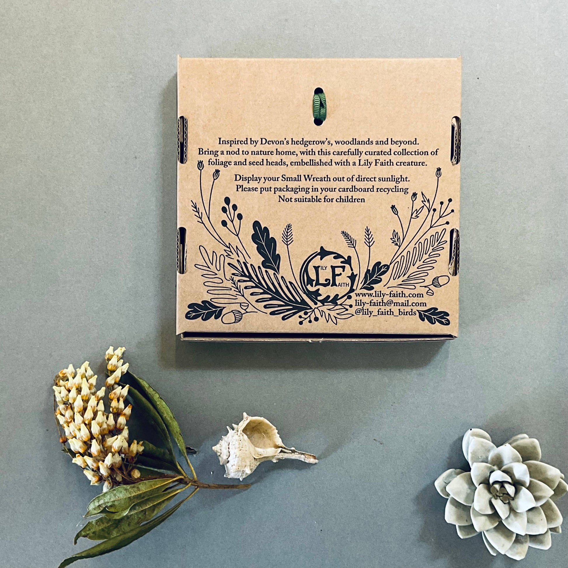 Back of the box, with illustrations and information on the inspiration for the piece and to let people know the packaging can be recycle and it is not a toy, not suitable for children.