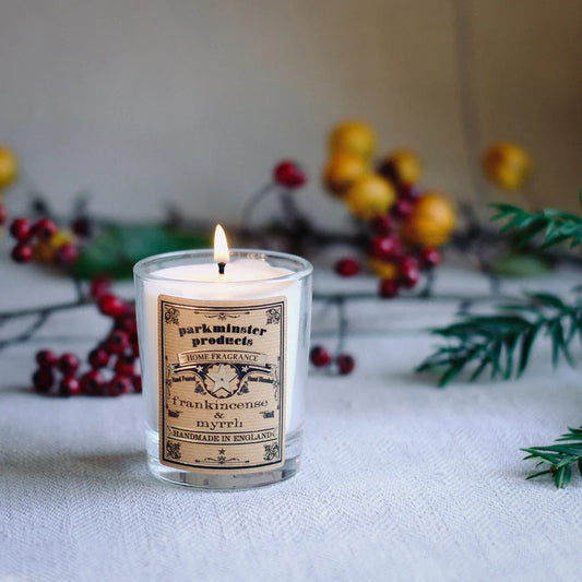 Frankincense & Myrrh scented votive candle by Parkminster. In a clear glass jar.