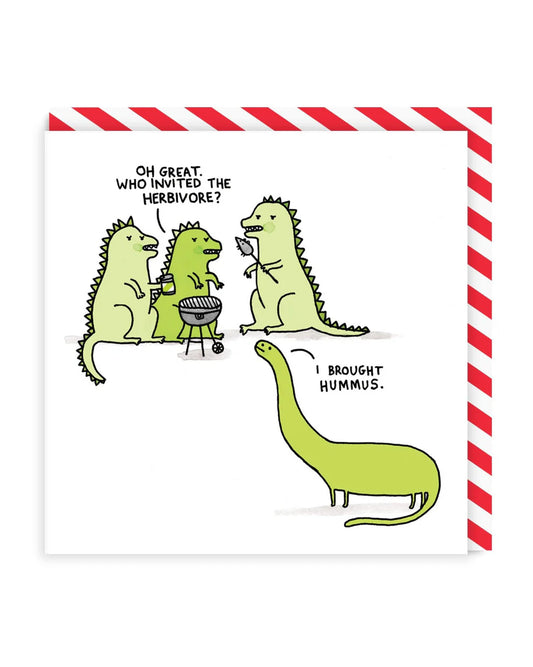 Experience the charm of Herbivore BBQ with this greeting card designed by Gemma Correll. Share the love for plant-based BBQs with a unique and eye-catching design. Perfect for any occasion, this card is sure to bring a smile to the faces of fellow herbivores! Three green illustrated dinosaurs chatting around a BBQ. A diplodocus arrives saying I brought hummus and one of the dinosaurs says Oh great who invited the herbivore.