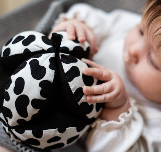 Sensory Grasp Ball. The grasp ball has a perfectly scaled Dalmatian pattern to support your baby's visual development and capture their attention.