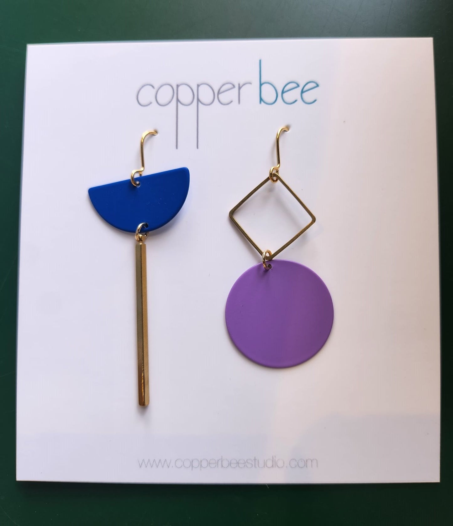 Statement Mismatch Copper Bee Earrings. Handmade in the UK. One earring is Inky Blue  and one is Lilac with Brass.