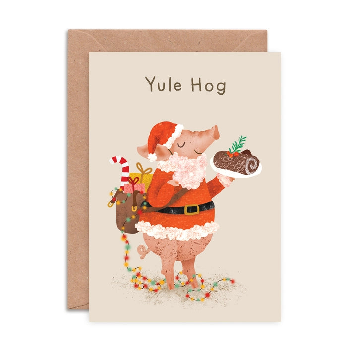 Yule Hog Christmas Card. Hog dressed up as Santa with a sackful of presents and holding a chocolate yule log