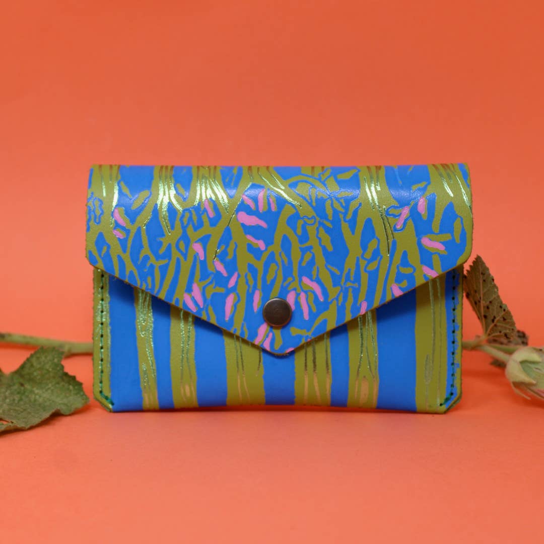 Introducing the newest addition to the Ark Colour Design collection - the Forest Popper Purse! Designed in our Cambridge studio and crafted in Scotland, they have created a striking embossed tree design which is designed to be practical and joyful. Individually hand embossed with both shiny and matte foil.